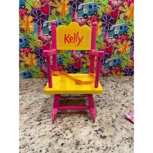 Mattel 2001 Kelly Sister of Barbie Doll high chair pink and yellow 16" Soft Doll